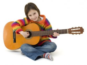 Girl playing a guitar